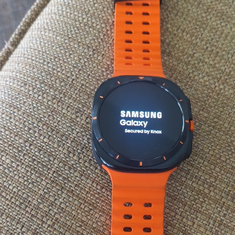 Samsung Smartwatch Ultra with Black Face and Orange Strap